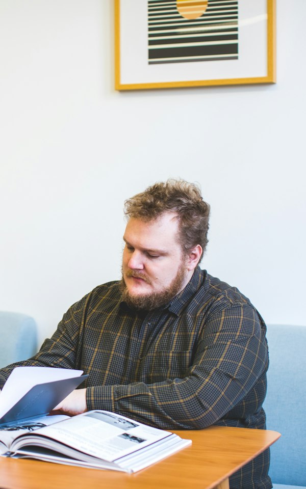 Adult learner reading at a table